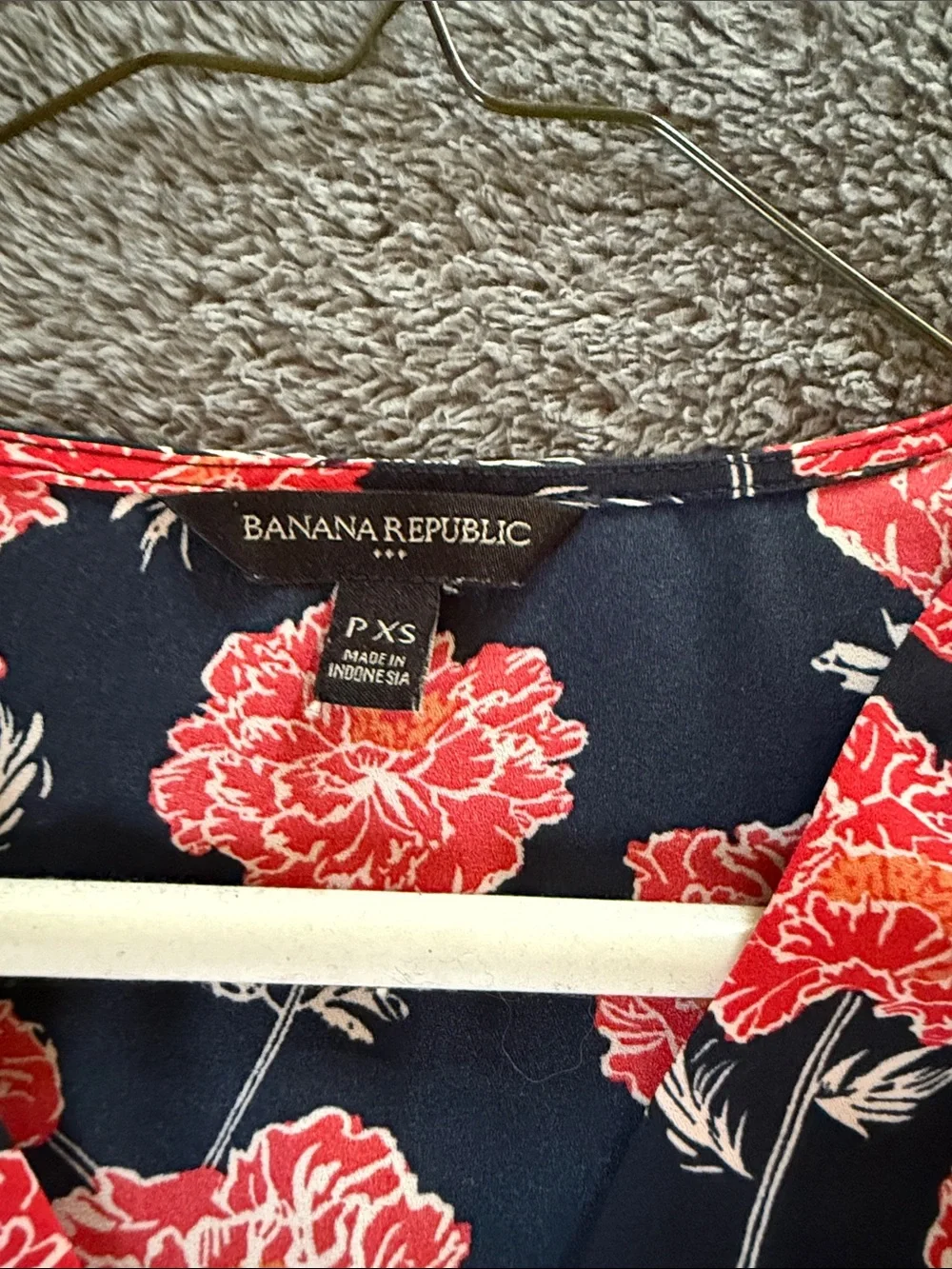 Two Banana Republic sleeveless blouses.